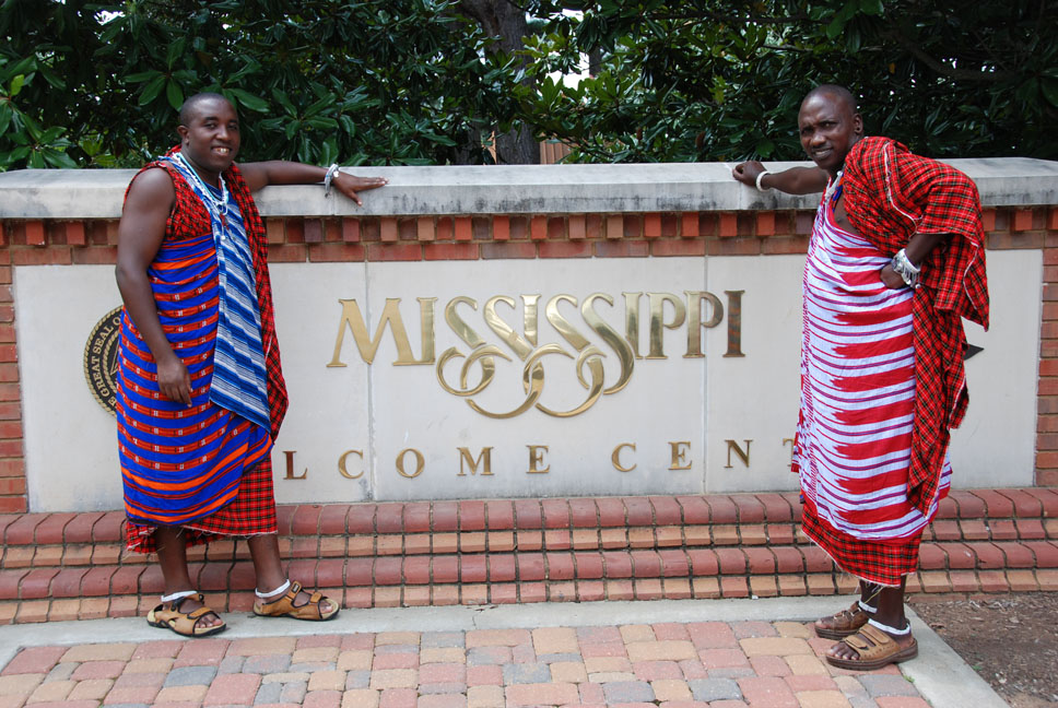 Yona and Maliaki standing proud in front of one of many states travelled.